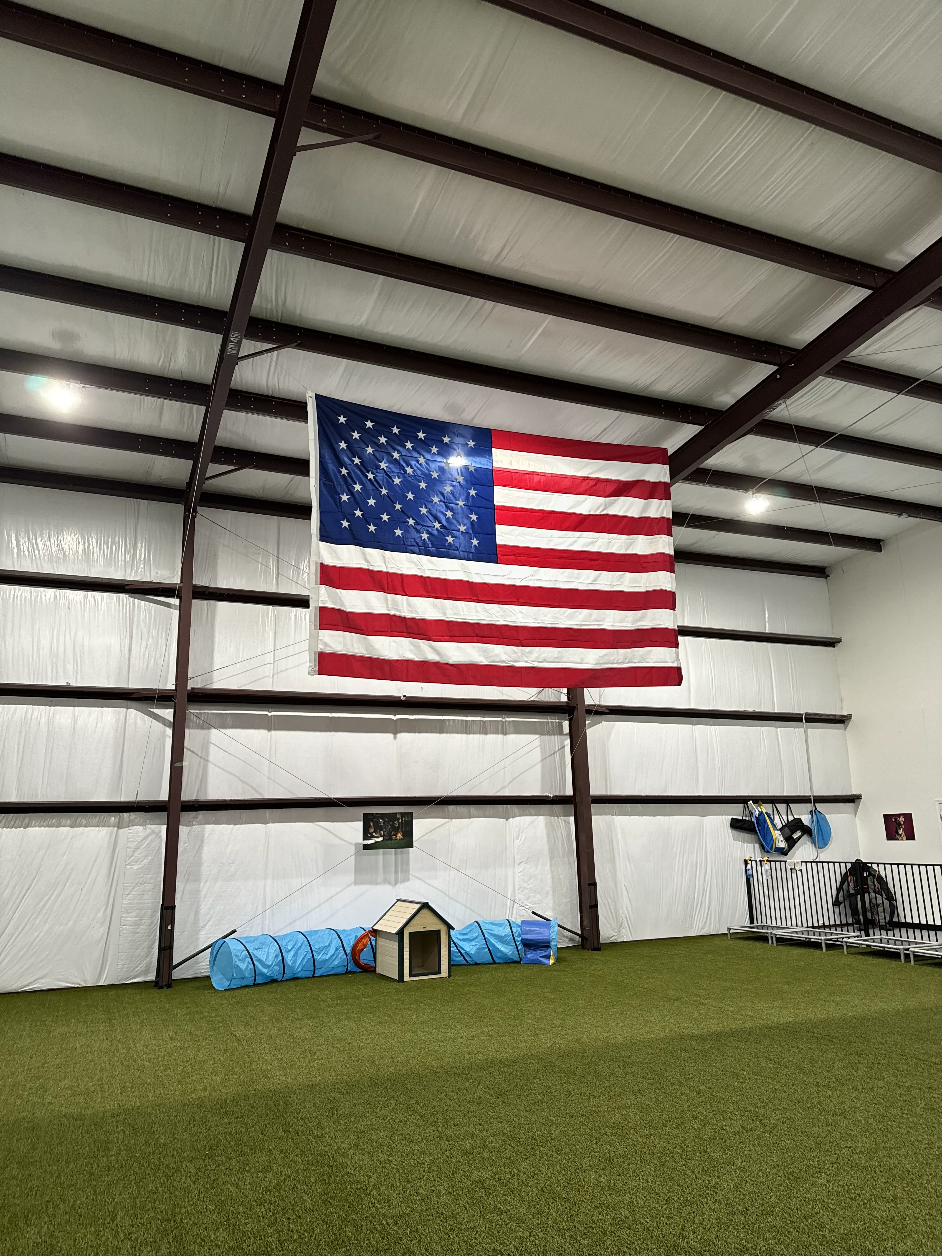 K9 Clubhouse indoor facility with American flag