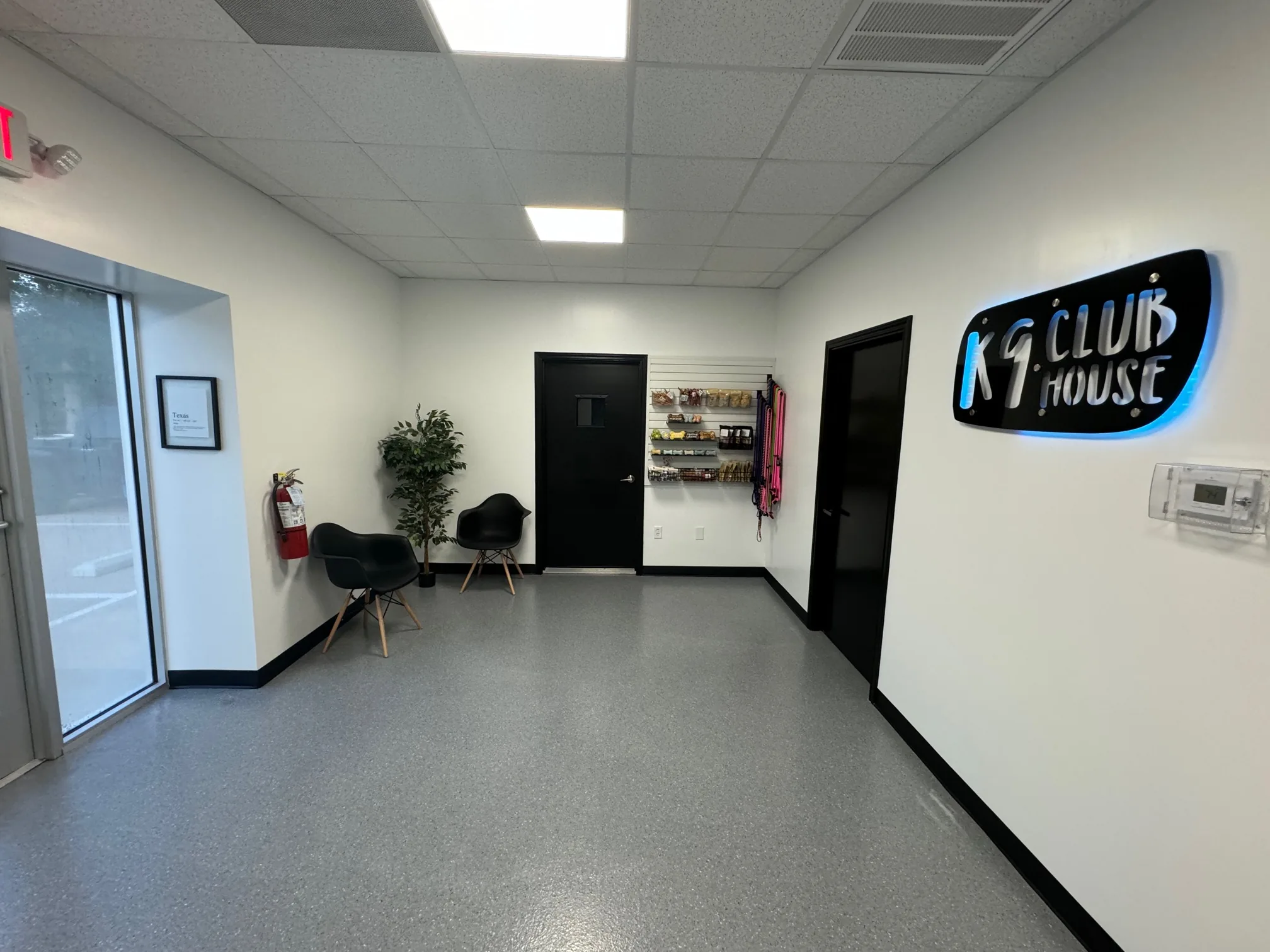 K9 Clubhouse lobby with illuminated sign